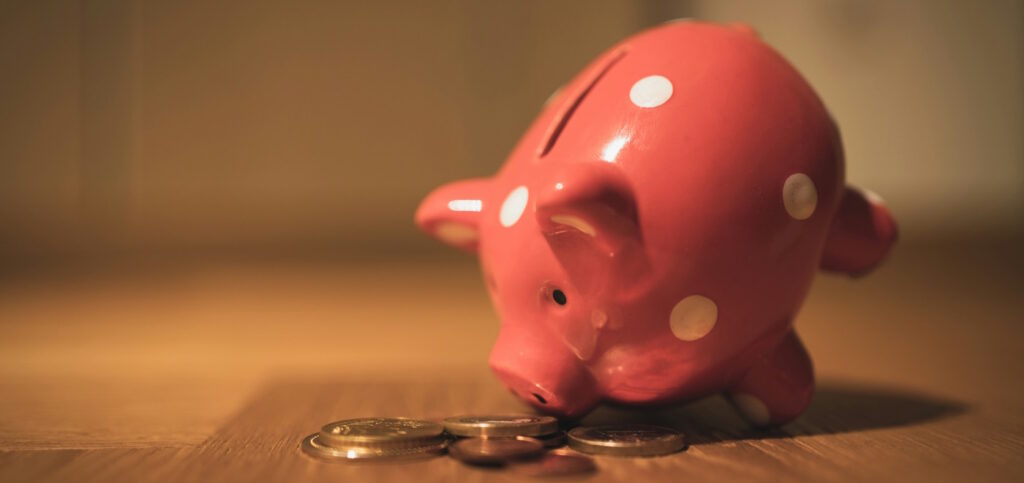 a picture of a piggy bank with coins